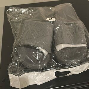 Men’s size 13 grey slides. Brand: The Hundreds